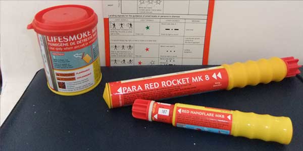 Smoke float, rocket parachute flare and red hand flare