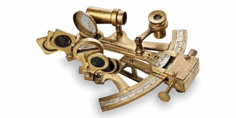 Brass sextant isolated on a white background