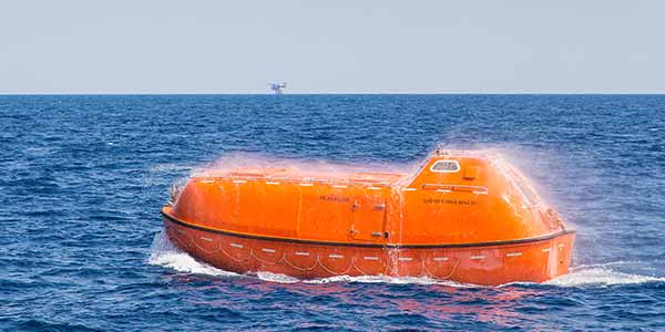 Fire protected lifeboat with its spray running