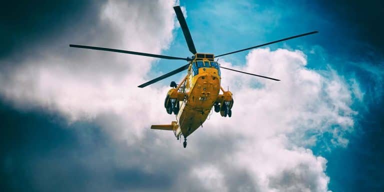 Search and rescue helicopter hovering overhead