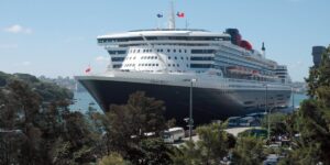 Queen Mary 2 alongside a terminal