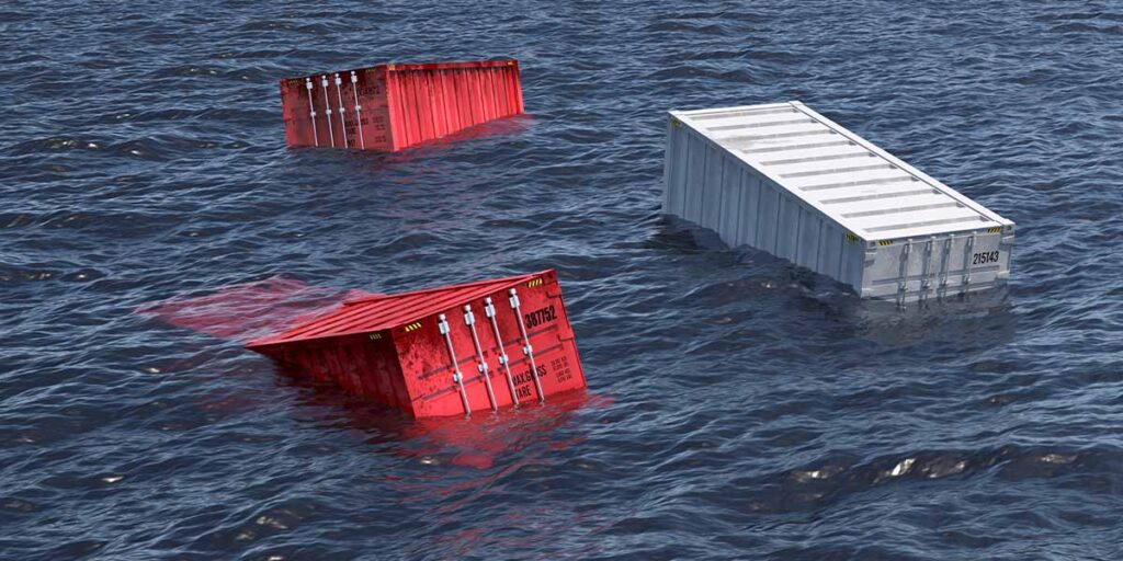 A photograph showing two red shipping containers and one white shipping container which have fallen off a ship into the ocean