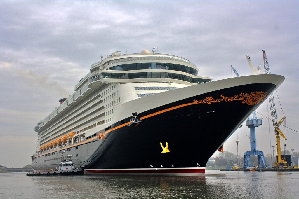 A photograph showing the Disney cruise ship Disney Dream sailing out of the Meyer Werft shipyard in Germany